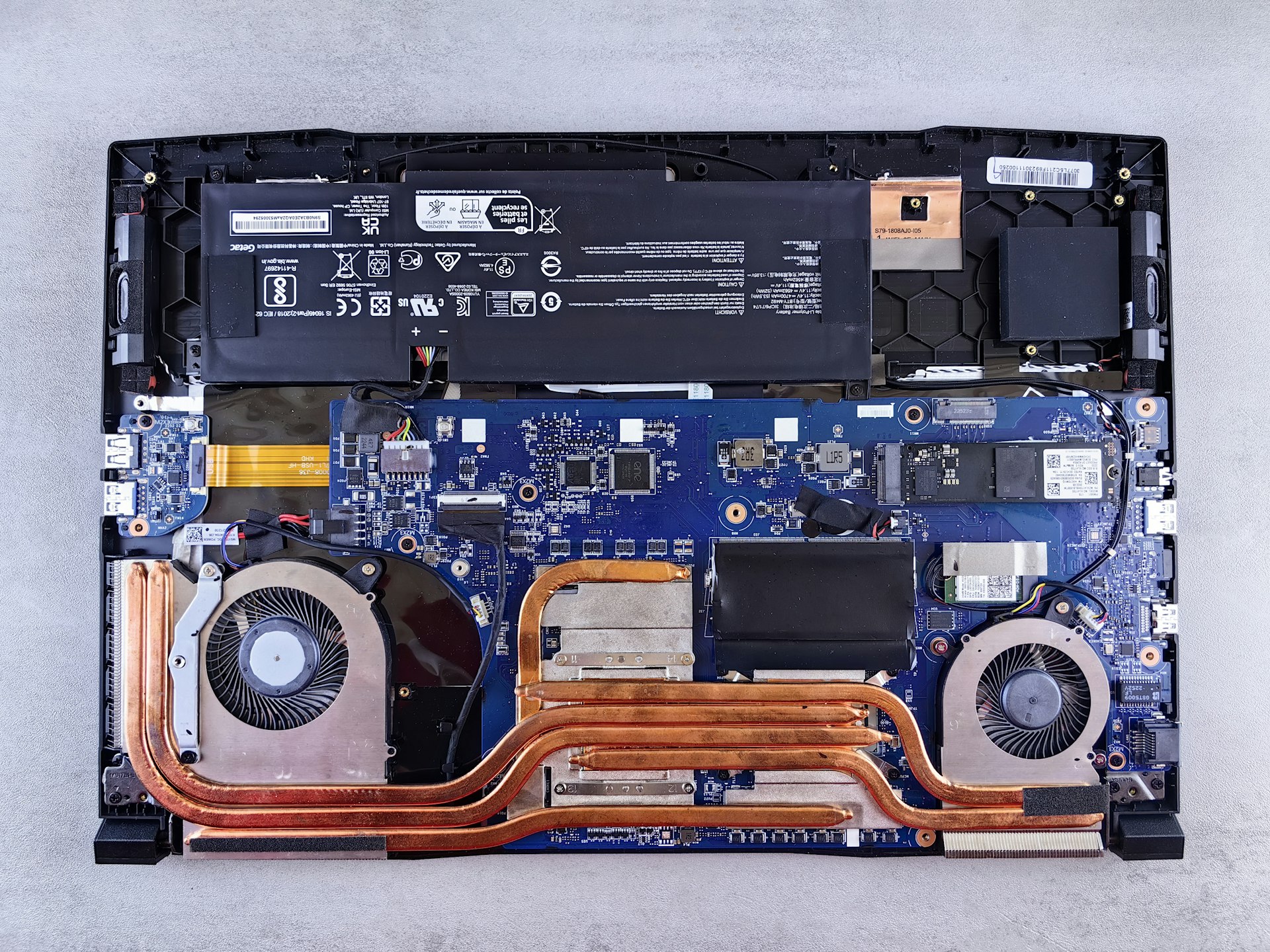 laptop bottom the motherboard of a laptop is being dismantled